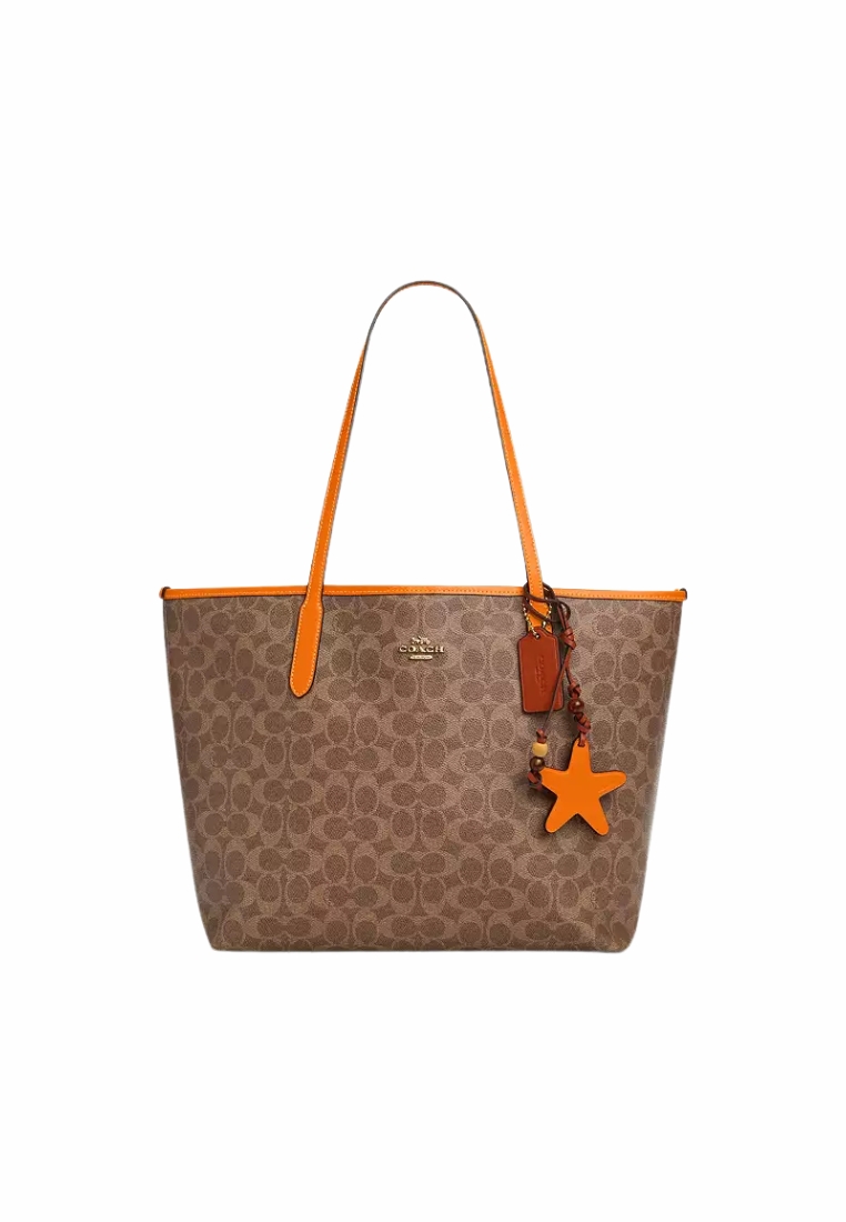 COACH Coach City In Signature Canvas With Star Charm Tote Bag In Tan Bright Mandarin CBH77